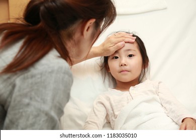 asian little girl in hospital - Powered by Shutterstock