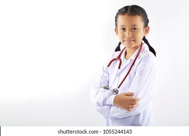 Asian Little Girl In A Medical Suit Dream At The Doctor, Portrait Of Asian Doctor
