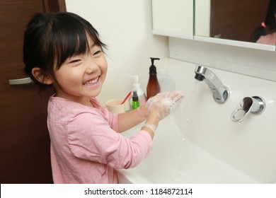 Asian Little Girl Washing Hands