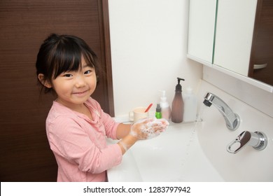 Asian Little Girl Washing Her Hands