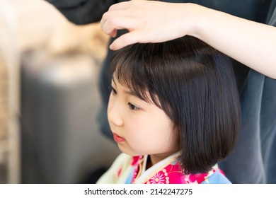 Asian Little Girl Wearing Kimono. Japanese Traditional Clothes Dressing Up. Memorial Photo. Shichi-go-san.