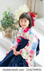 Asian little girl wearing kimono. Japanese traditional clothes. Memorial photo.