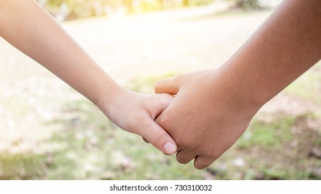 Asian little girls holding hands couple together show Relationship between sister and family at garden outdoor, Love parents friendship concept.