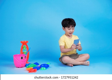 Asian little handsome kid full body length isolated on blue background - Powered by Shutterstock