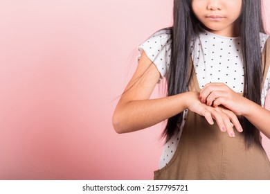 Asian Little Kid 10 Years Old Scratching Itch Back Hand From Mosquito Bite At Studio Shot Isolated On Pink Background, Child Girl Dermatitis And Scabies, Allergy Symptoms, Healthcare And Medicine