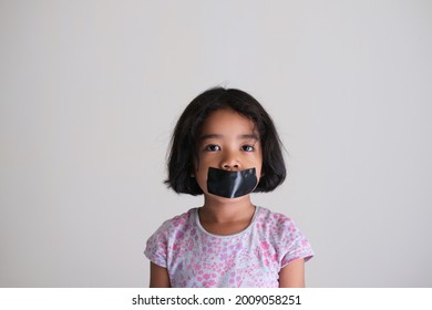 Asian Little Kid Girl Covered Her Mouth With Black Duct Tape