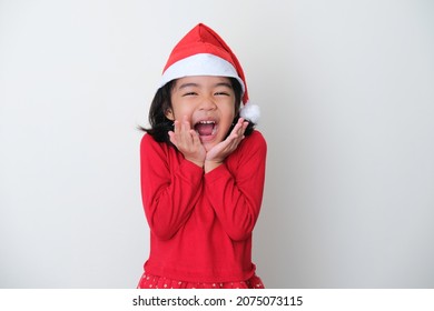 Asian Little Kid Wearing Christmas Hat Showing Happy Face Expression