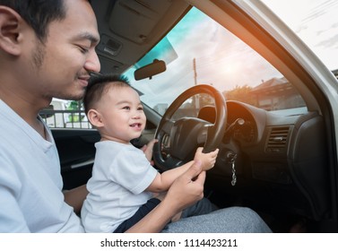 Asian Little Son Driving Car With Father For Going Travel, Happy Family Leisure In Holiday Weekend.