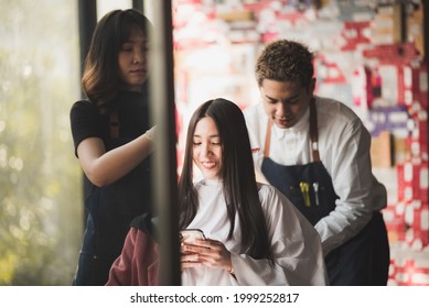 Asian Long Black Straight  Hair Female Cutting Her Hair At Luxery Salon With Professional  Dresser With Scissor Tool.