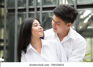 Asian lover join together with full of love emotional in summer light (love couple or pre-wedding concept)