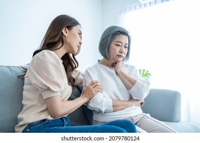 Asian Loving Daughter Comforts Upset Elderly Mother Crying For Problem. Young Caring Woman Support, Consoling And Understand Empathy To Stressed Senior Older Mom In Tears At Home. Family Relationship.