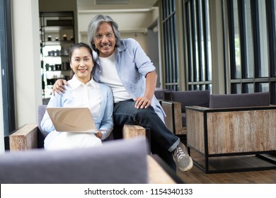Asian of loving senior couple using laptop computer in cafe,Family concept