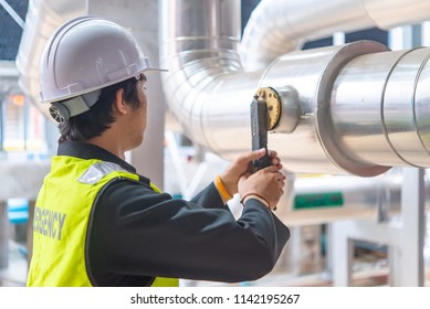 Asian Maintenance Engineer At The Waste Water Management System Of A Huge Factory,maintenance Checking Technical Data Of Heating System Equipment,Thailand People