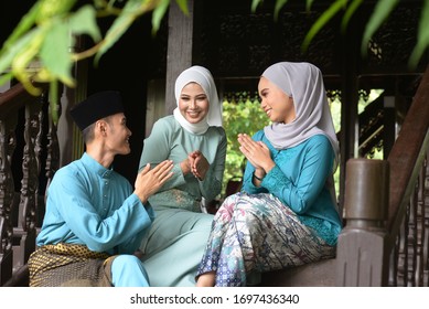 Asian Malay Muslim Greetings During Hari Raya Aidilfitri. Malaysian People Living Lifestyle.