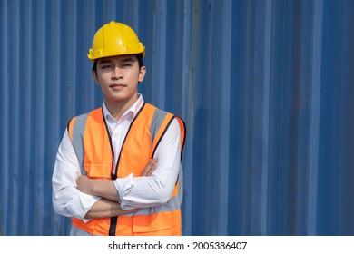 Asian Male Cargo Worker wth Crossed Arms Pose with Container Background