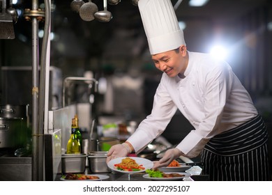 Asian Male Chef Presenting Dish Kitchen Stock Photo 2027295107 ...