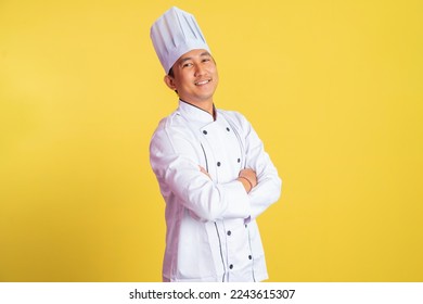 asian male chef smiling with hands crossed on isolated background - Powered by Shutterstock