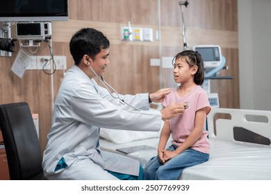 Asian male doctor gently examine a young girl in the hospital, ensuring her comfort and care throughout the process. - Powered by Shutterstock