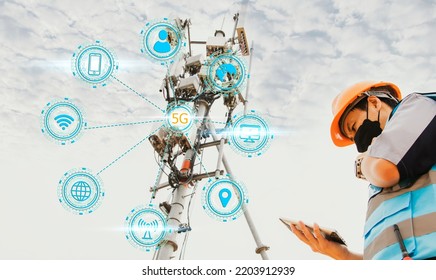 Asian male engineer helmet works check in in the field using tablet in a tall building to monitor telecommunication signals 5G networks, Internet network data telecommunication towers.
 - Shutterstock ID 2203912939