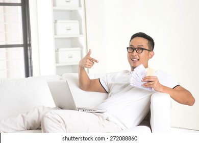 Asian Male Enjoying Cash Back Credit Card