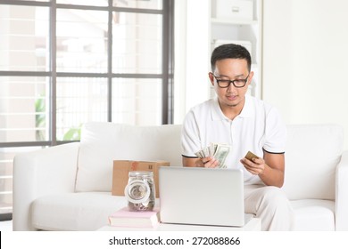 Asian Male Enjoying Cash Back Credit Card