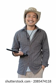 An Asian male farmer in a hat holding a tablet is smiling happily. isolated from the white background