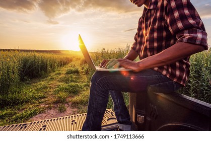 Asian Male Farmer Working In Farm To Collect Data To Study And Develop His Farm To Improved Productivity In The Future.Good Farming Theory Of Asia.Smart Farming Concept.