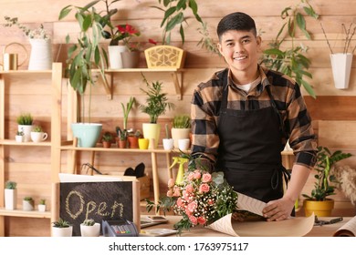 Asian Male Florist Working In Shop