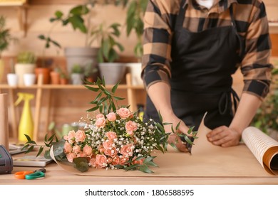 Asian Male Florist Working In Shop