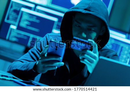 Asian male hacker fraudulently use credit card for payment