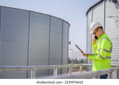 Asian Male Industrial Engineer Work Through A Laptop To Quality Inspection In The Engineering Industry Utilities, Water Pipes And Sewage Pipes