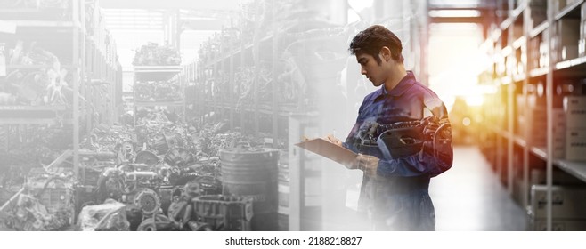 Asian male mechanic worker working at old motor automotive spare parts warehouse. Male engineer checking old engine, motor, machine at the garage industry factory. Double exposure