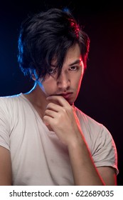 Asian male model portrait with blue and red rim light