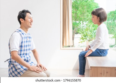 Asian Male Nurse And Child
