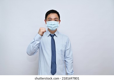 Asian Male Office Worker Wearing Face Mask, White Background.