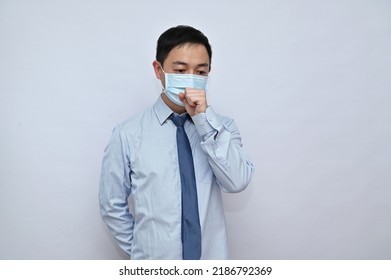 Asian Male Office Worker Wearing Face Mask, White Background.