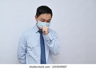 Asian Male Office Worker Wearing Face Mask, White Background.