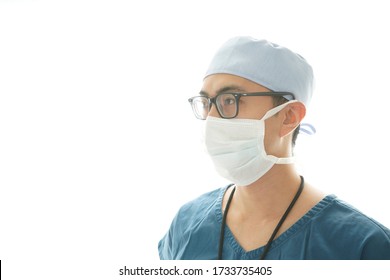 Asian Male Registered Nurse With A Surgical Mask