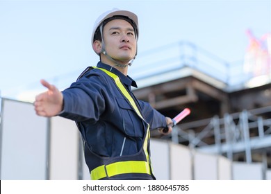 Asian Male Security Guard Working In The Field