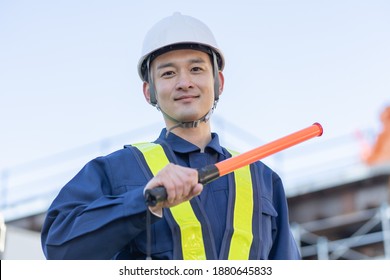 Asian Male Security Guard Working In The Field