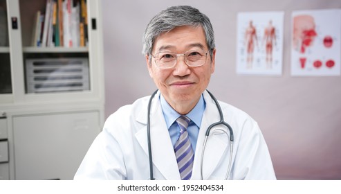 Asian Male Senior Doctor Look At You