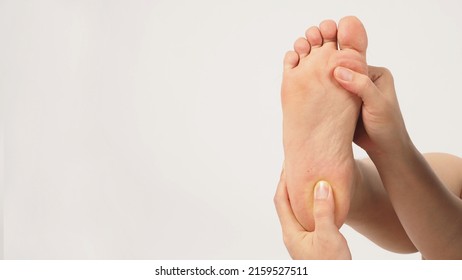 Asian Male Soles Barefoot And Hand Fingers Are Pressing Isolated On White Background.