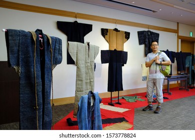 An Asian Male Tourist Looking At A Display Of Old Japanese Traditional Clothings Or Kimono At A Museum In Tokugawa Garden, Nagoya, Japan.