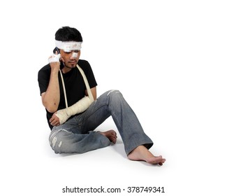 Asian Male Victim Sitting On The Floor And Making Phone Call, Full Body Shot Isolated On White Background