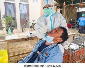 An Asian Male Worker Doing A Rapid Antigen Test, Corona Virus Swab Test, December 30 2021, Bontang, East Kalimantan, Indonesia