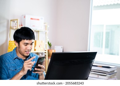 Asian Man Administrator Staff Call Center In Home Service Office Assistance Work From Home Looking Data Customer From Computer Communication During Coronavirus Covid-19