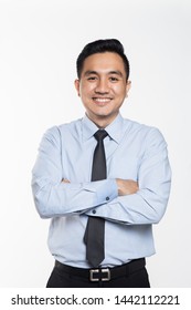 Asian man with arms crossed smiling 