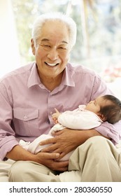 Asian Man And Baby Granddaughter