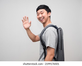 Asian Man With Backpack Smile Turn Around To Say Hello Isolated