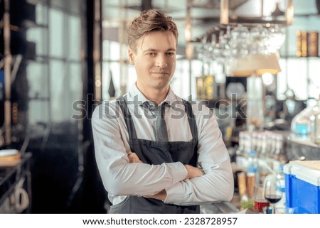 Asian man bartender and his customer talking in roof top bar and  restaurant with beverage counter